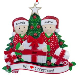 Image of Couple Loves Christmas Opening Presents By Tree Ornament