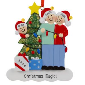 Image of Couple With 1 Child Stringing Christmas Lights Ornament