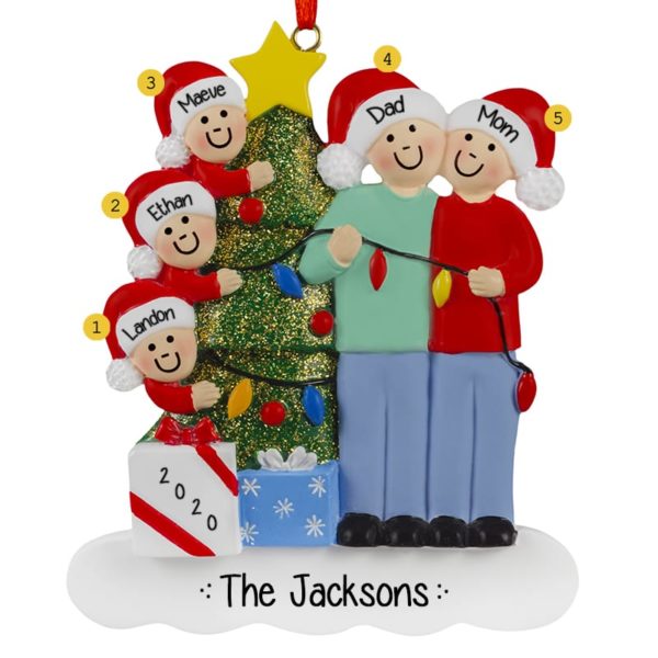 Image of Christmas Couple With 3 Kids Stringing Lights Ornament
