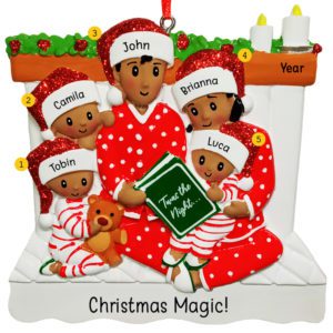 Image of Family Of 5 Reading Book On Bed Wearing Glittered Caps Ornament AFRICAN AMERICAN