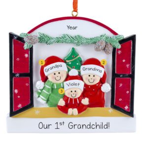 Image of Grandparents With 1st Grandchild Peeking Out Of Festive Window Ornament